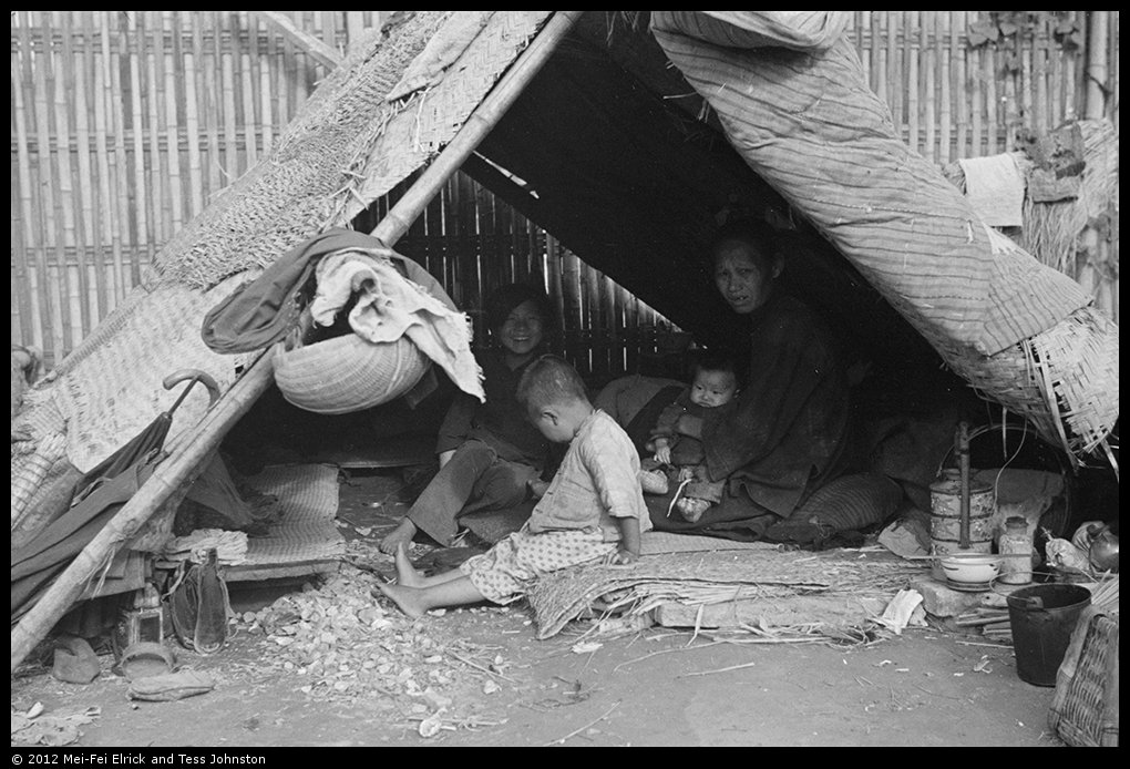 Woman and children in temporary shelter, Shanghai, Rosholt Collection, Ro-n0384.