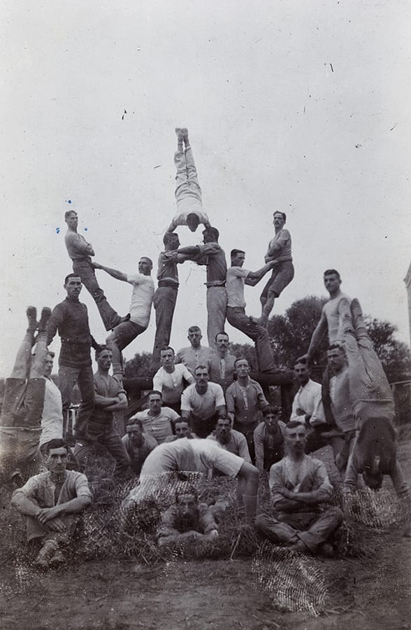 Acrobatic display by Somerset Light Infantry soldiers, c. 1913. HPC ref JC-s056. The sort of photograph that soldiers will have sent in letters home.
