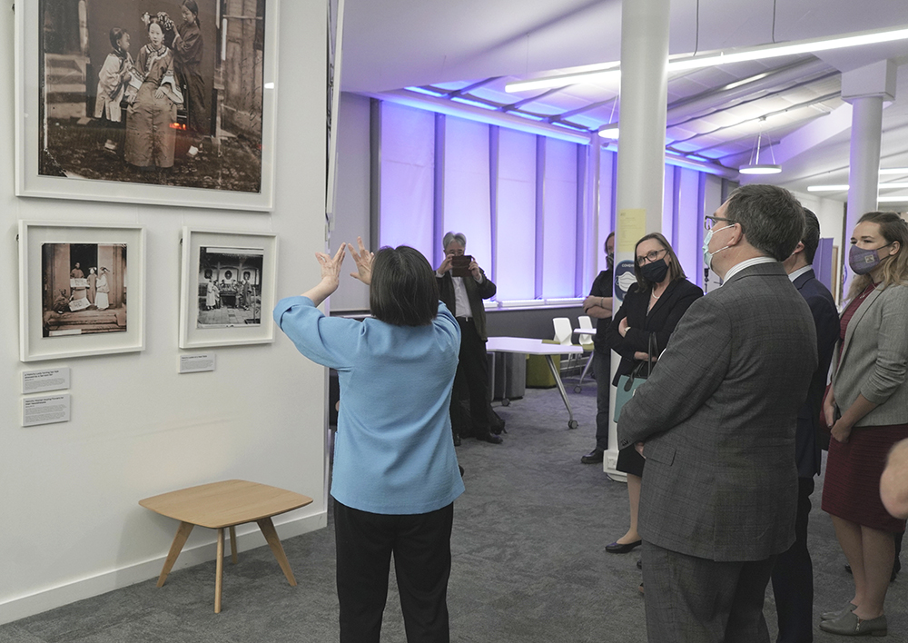 Betty Yao MBE giving a guided tour of the exhibition to Professor Richard Williams, Principal of Heriot-Watt University and Ma Qiang, the Chinese Consul in Edinburgh. Photograph by Michael Pritchard.